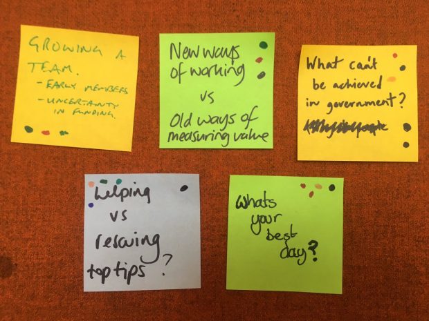 Discussion topics on post-it notes from a recent OneTeamGov meet-up, courtesy of @becpye. The post-its read: 'Growing a team', 'New ways of working versus old ways of measuring value', 'What can't be achieved in government?', 'Helping versus rescuing top tips?' and 'What's your best day?'