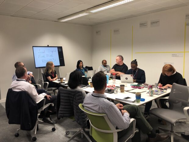 Members of the external panel and the Local Digital Collaboration Unit sat around a table, discussing the shortlisted applications.