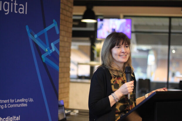 An image of Gill Stewart speaking at an event