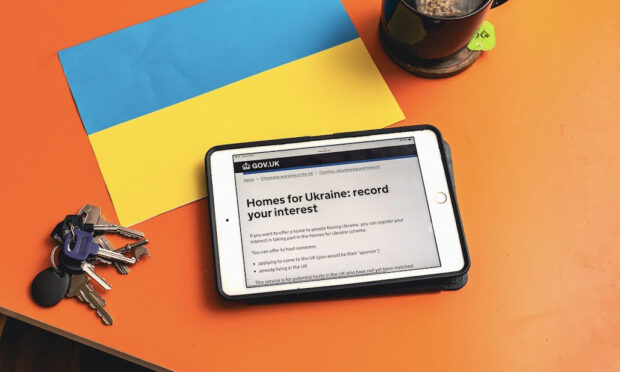 an ipad showing the 'Homes for Ukraine: record your interest' page on GOV.UK