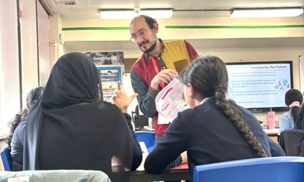 Gideon Goldberg in a classroom, talking to students 