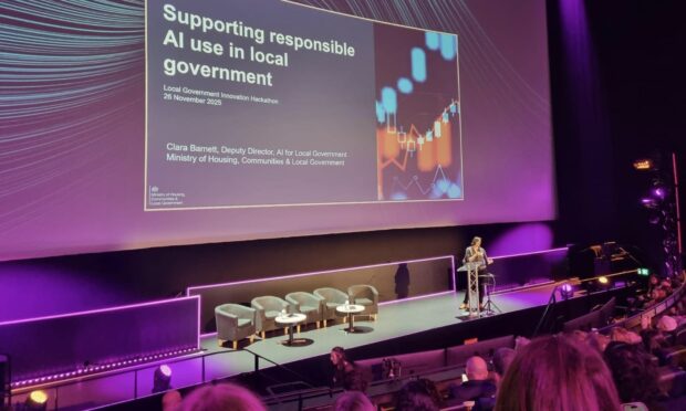 a keynote speaker delivering a presentation on stage