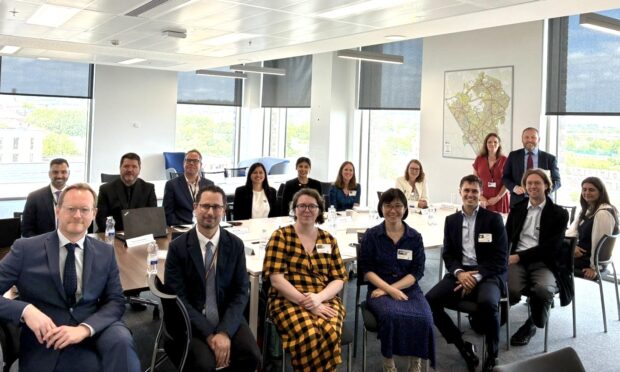 A group photo of the Minister for Data and Modern Digital Government and council staff